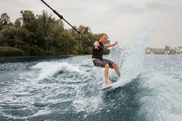 Can You Wakesurf Or Wakeboard Behind A Pontoon Boat? - Waves Weekender